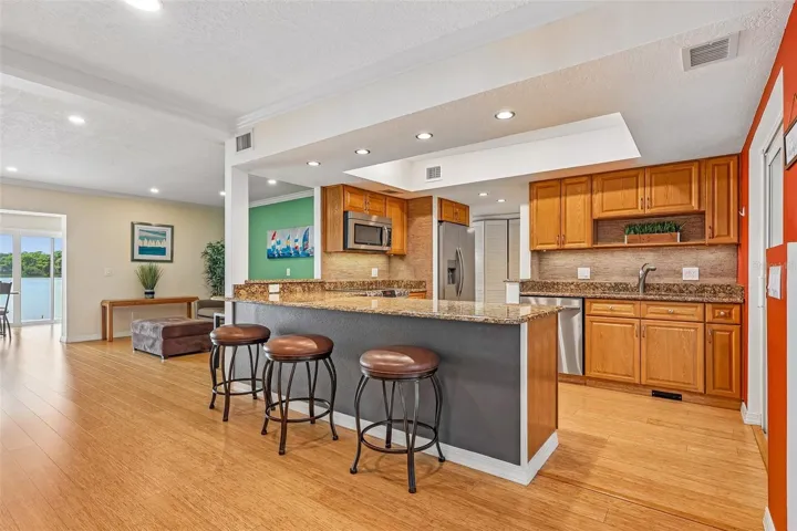 The breakfast bar has room for counter-height stools and provides extra prep space.