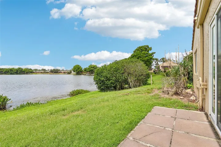 Step through the sliding glass doors and enjoy the beautiful view of Lake Howell.