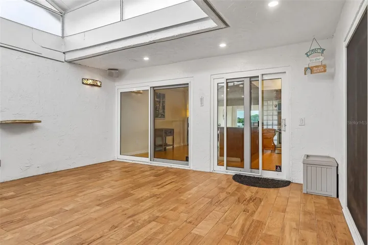 With its soaring cathedral ceiling and DRAMATIC ANGLED WINDOWS OVERHEAD, this versatile space feels like a private sunroom where you can relax and unwind at the end of the day.