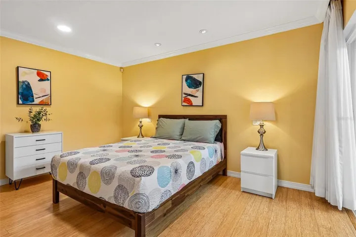 The Primary Suite provides a TRANQUIL ESCAPE, featuring sliding doors leading directly to the conservatory, dual closets, and an EN SUITE BATH.