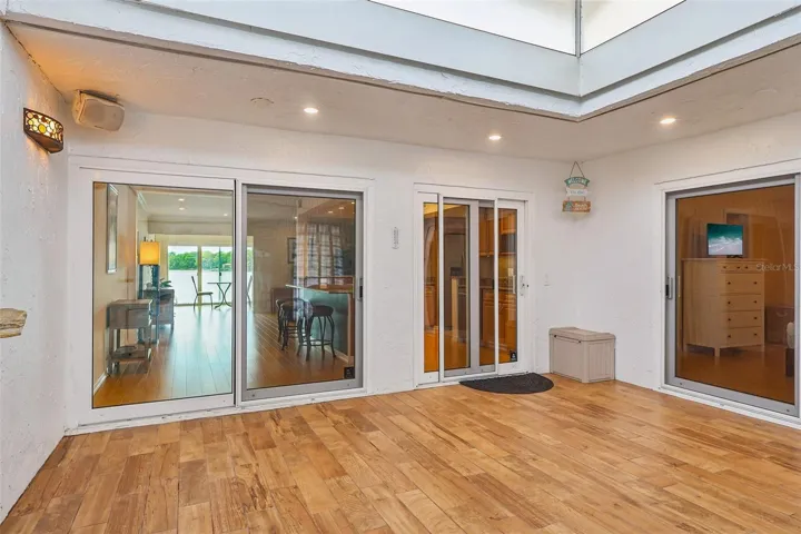 With its soaring cathedral ceiling and DRAMATIC ANGLED WINDOWS OVERHEAD, this versatile space feels like a private sunroom where you can relax and unwind at the end of the day.