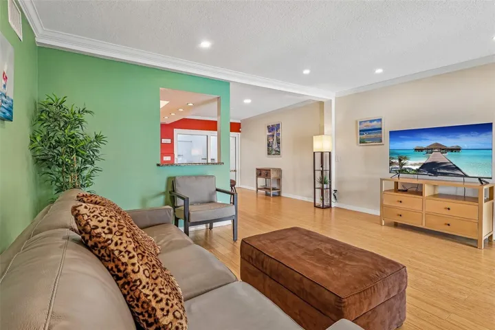 The CONVENIENT PASS-THROUGH WINDOW creates a seamless connection from the Kitchen to the Living Room.