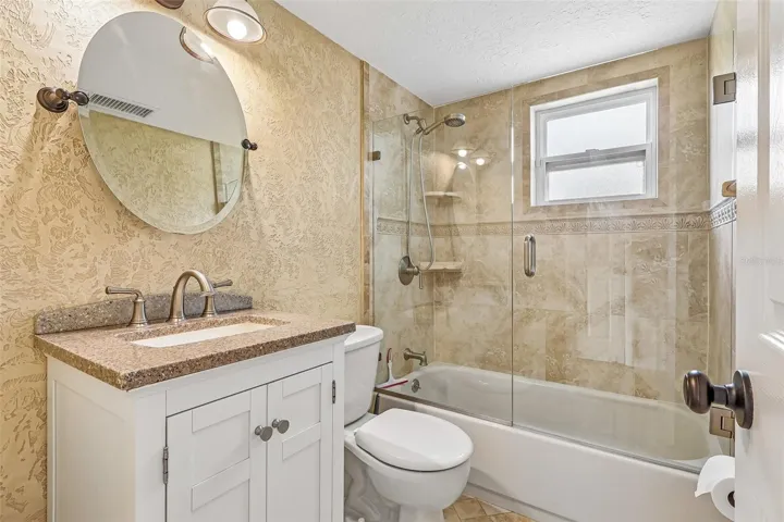 A second spacious bedroom is conveniently located near the ADDITIONAL FULL BATH, making the layout ideal for guests, family, or a home office.