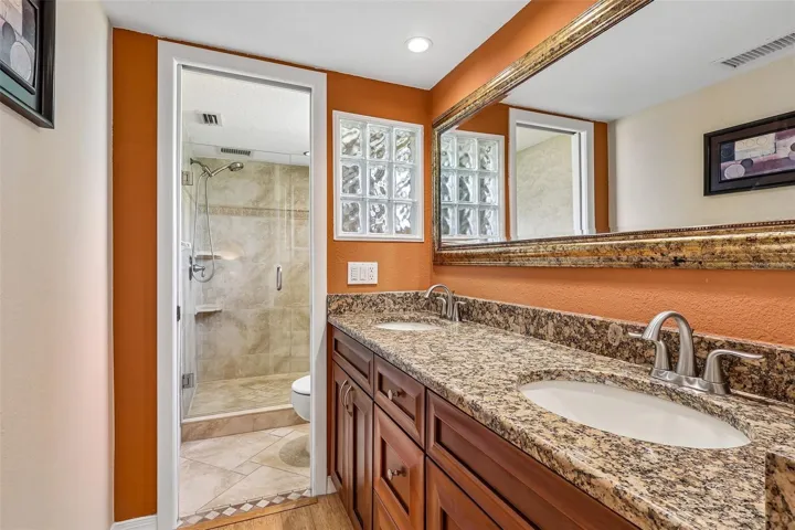 Relax at the end of your day in an EN SUITE BATH with dual sinks and a step-in shower.