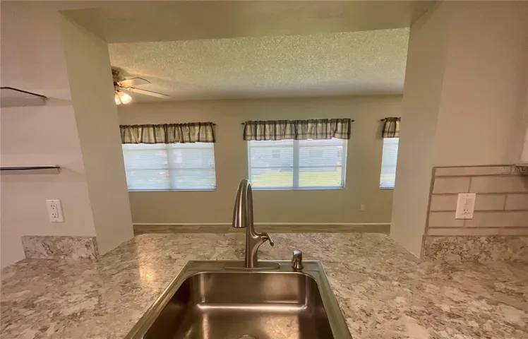 Kitchen sink area view to family room