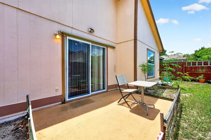 Sliding glass doors open to the patio.