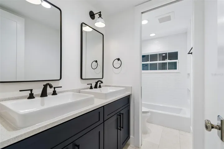 Bath w/ custom cabinetry, upscale fixtures