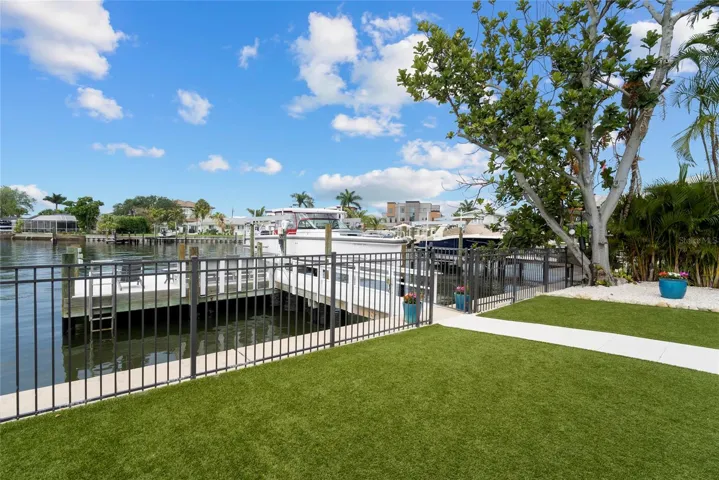 fenced yard and pavers prepped for pool childproof fencing
