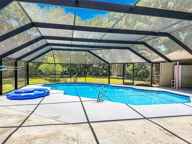 Expansive pool deck perfect for gatherings and outdoor entertainment