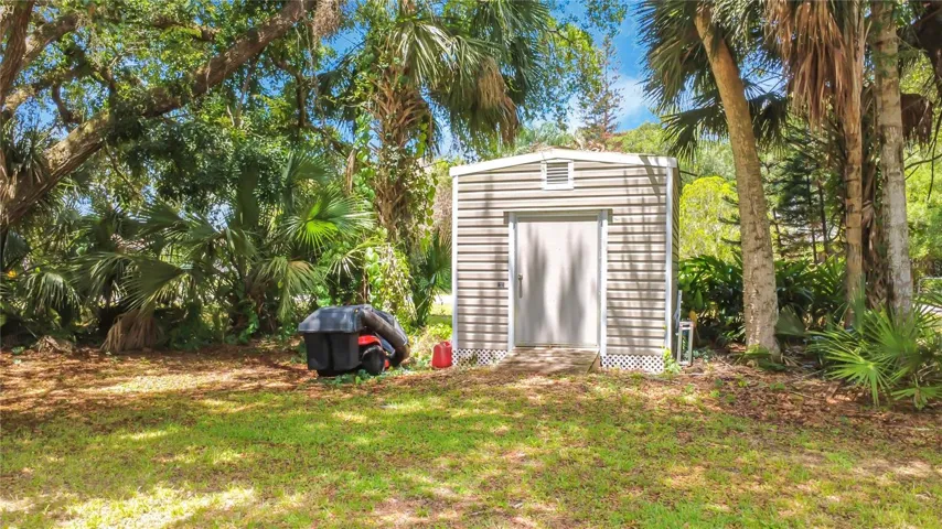 #2 Additional shed storage helps maximize garage space and organization.
