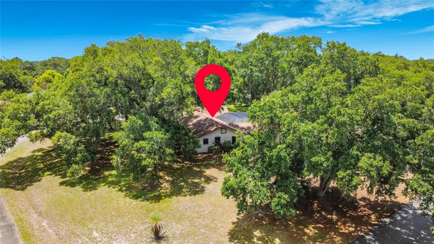 Well-maintained corner lot with mature landscaping