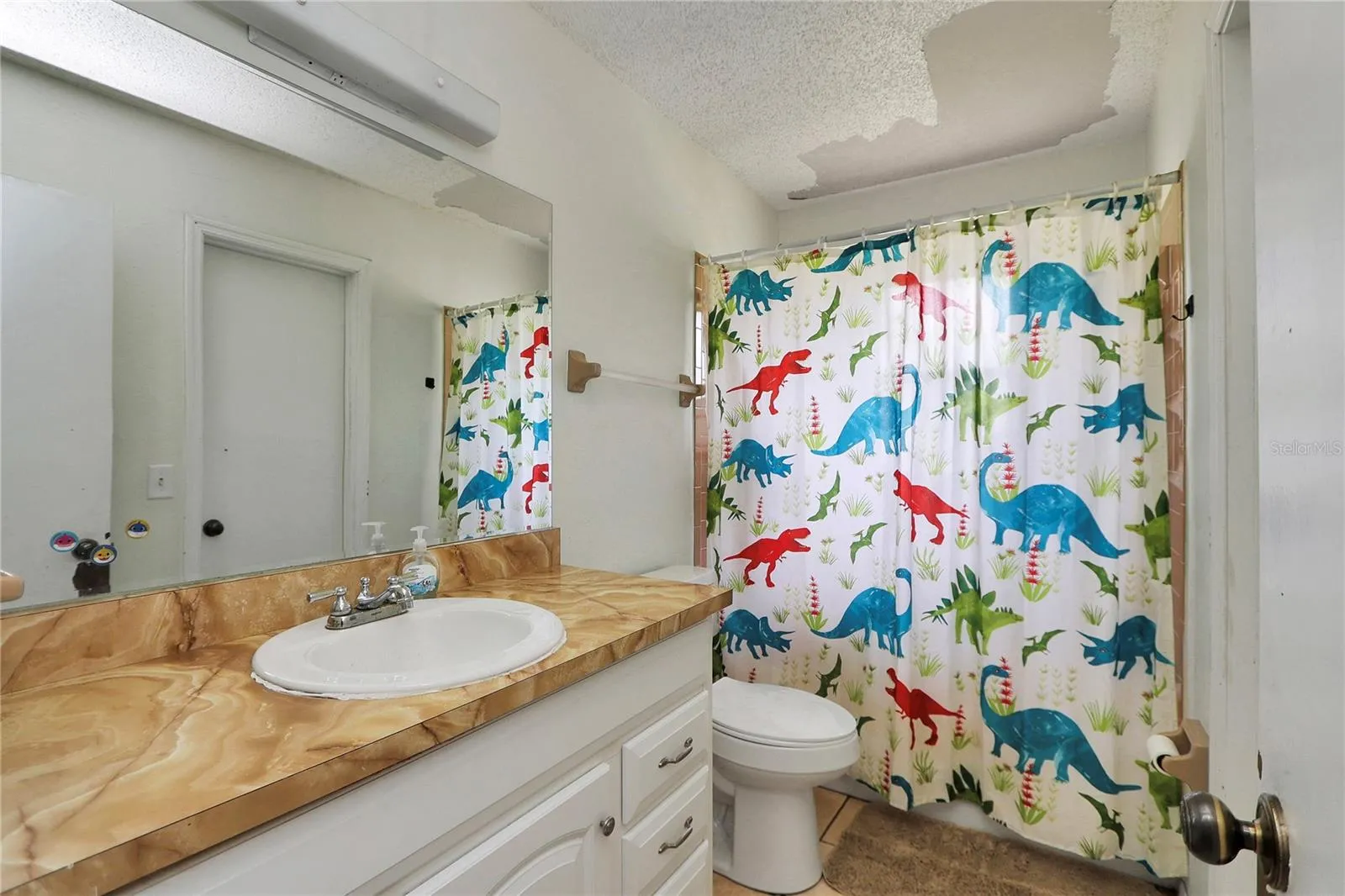 Hall bathroom also has private access door to second bedroom