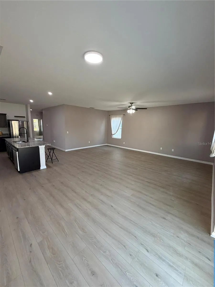 Designer LVP 9X60 throughout living areas ready to greet you! Expansive Living and Dining Areas open concept
