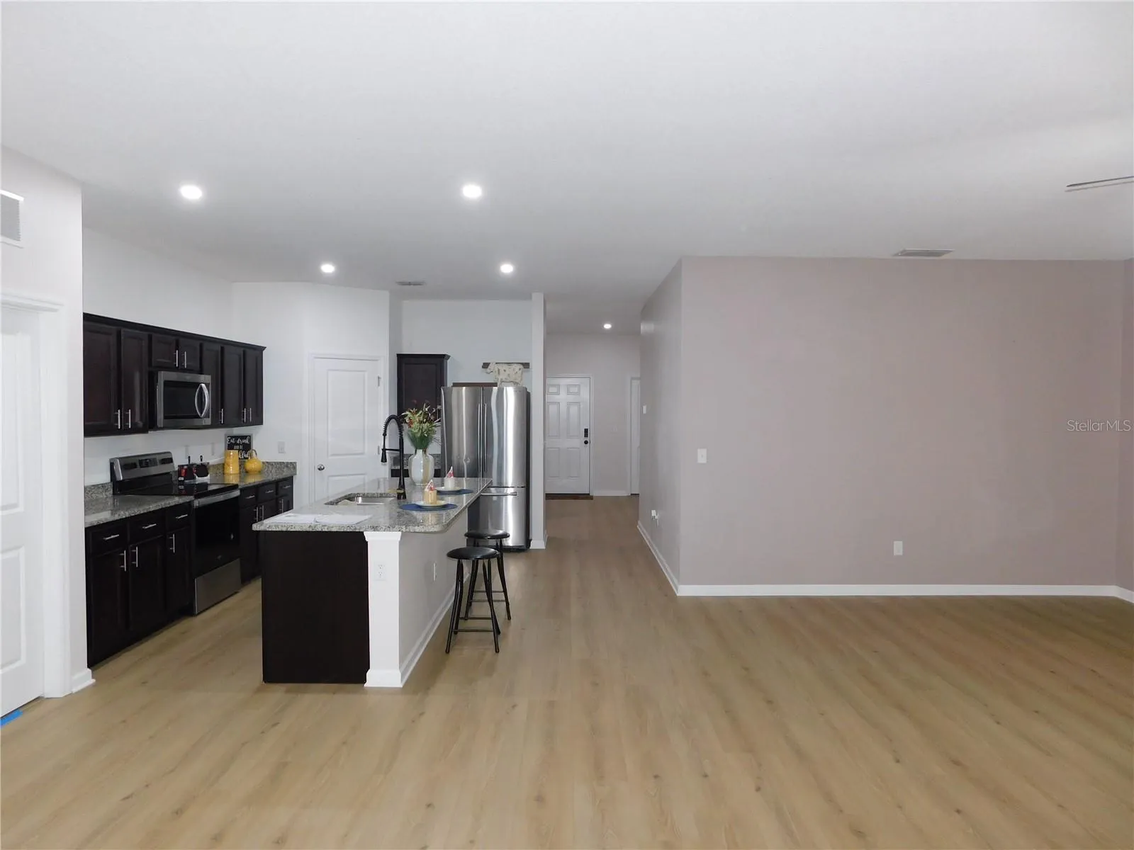 Designer LVP 9X60 throughout living areas ready to greet you!