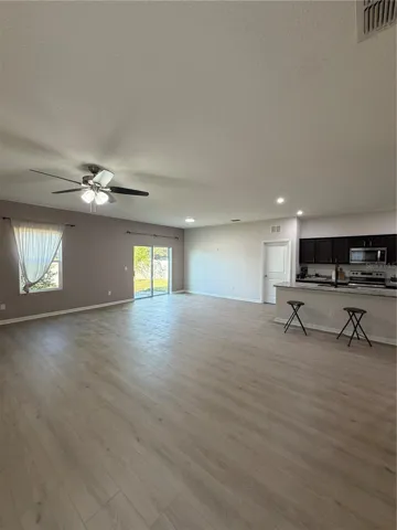 Designer LVP 9X60 throughout living areas ready to greet you! Expansive Living and Dining Areas open concept