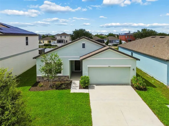 Beautiful modern curb appeal! Featuring contrasting dark trim, stone accents, and meticulously maintained lawn!