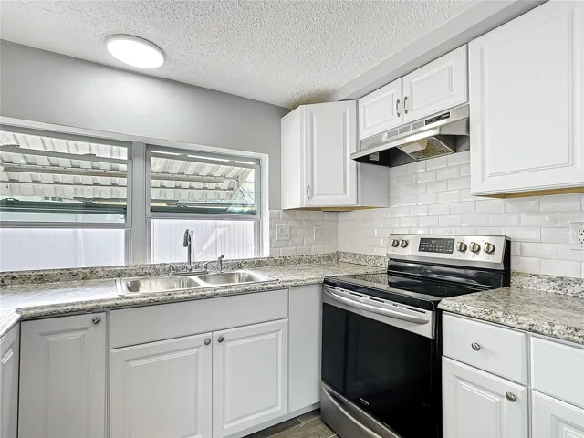 remodeled kitchen with SS appliances.