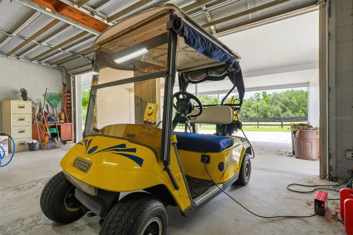 GOLF CART INCLUDED this additional garage is perfect for Hobbiest, Lawn Equipment, Storage, Workshop.