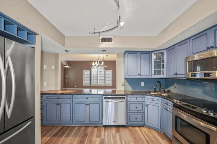 Kitchen - View to dining Room - Living Room Combo. Granite Counters, Stainless Steel Appliances