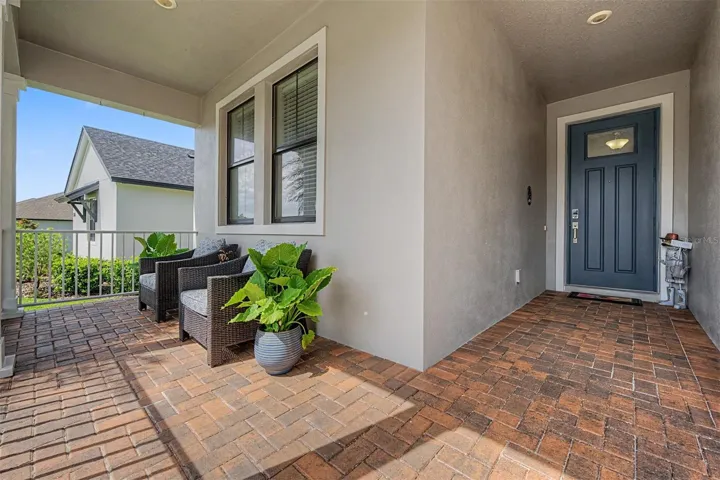 Inviting brick paver, covered front porch!