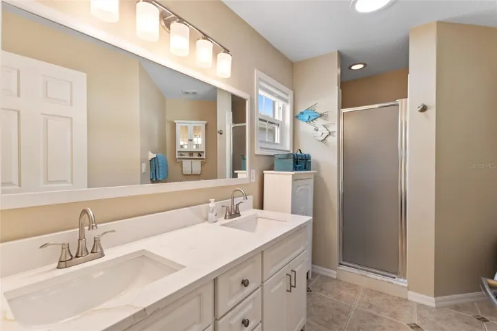 Newer counter tops, backsplash, faucets, sinks, lights & mirror