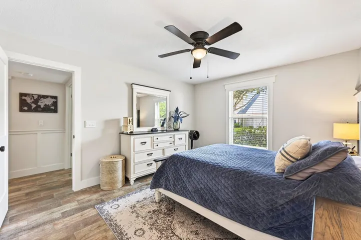 As you make your way through the hallway to the Bedrooms, you'll notice how its enhanced with CLASSIC WAINSCOTING, adding a refined touch of architectural detail.