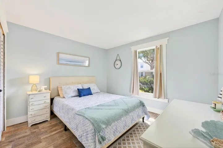 A second spacious bedroom and nearby full bath provide flexibility for guests, family, or a home office.