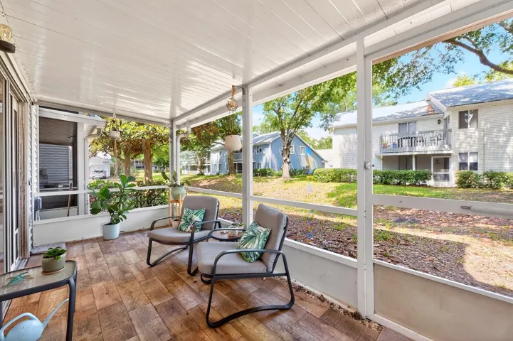 The COVERED and ENCLOSED SCREENED PATIO creates the perfect indoor-outdoor retreat for relaxing mornings or peaceful evenings.