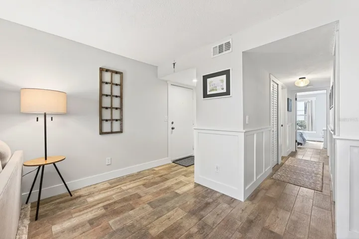 As you make your way through the hallway to the Bedrooms, you'll notice how its enhanced with CLASSIC WAINSCOTING, adding a refined touch of architectural detail.