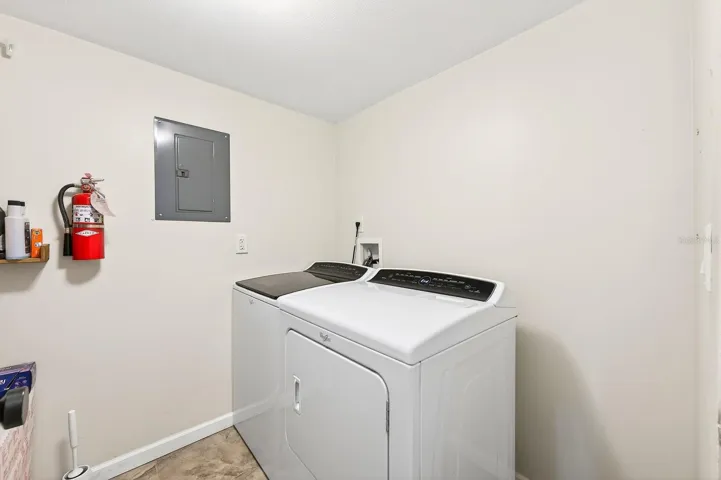 A convenient Laundry Room is complete with washer and dryer.