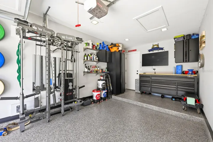 The home features a private 1-car garage with EPOXY FLOORING.