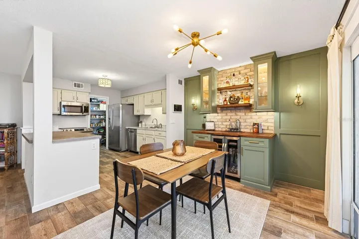 The bright and efficient Dining area adjacent to the Kitchen, offers the perfect space for meals and gatherings.