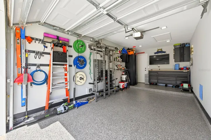 The home features a private 1-car garage with EPOXY FLOORING.