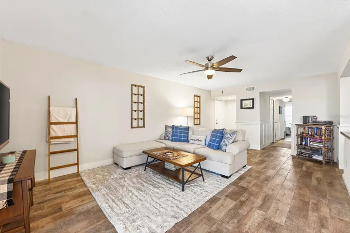 Updated WOOD-LOOK TILE FLOORING throughout the home creates a warm, modern feel while adding durability and easy upkeep.