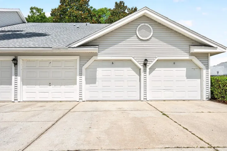 The home features a private 1-car garage with EPOXY FLOORING.