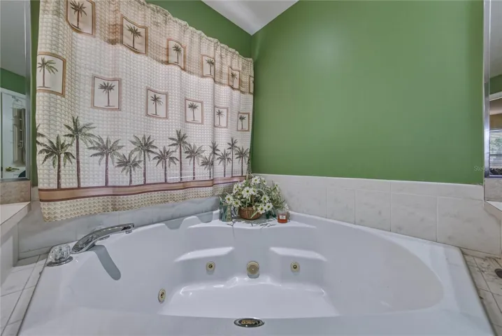 The corner jetted tub awaits your leisurely 