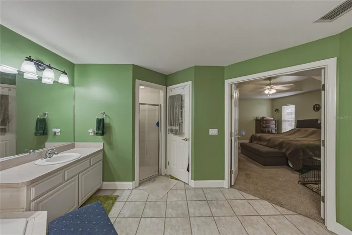The primary bath can be isolated from the primary bedroom by the double door.
