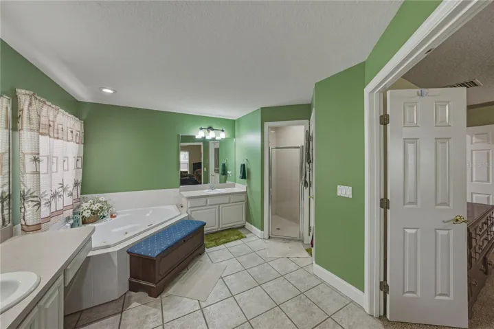 The primary bath has upgraded lighting fixtures.