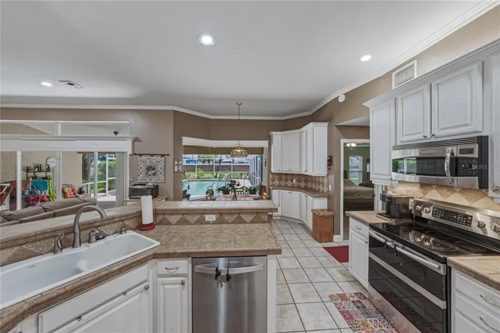 The cabinetry and counter space fills the west wall of the kitchen and dinette.