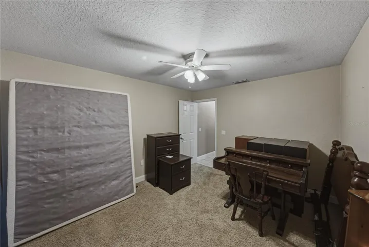 Bedroom 4 is at the rear of the home in the east wing.