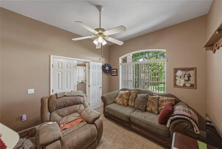 The den/home office's double arched window brightens this space.