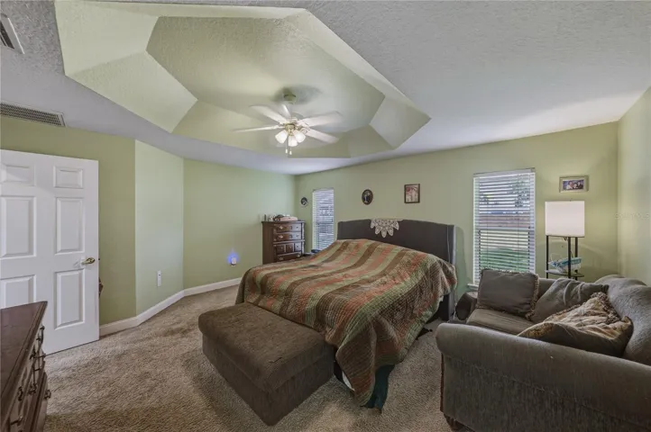 The primary bedroom is in the west wing of the home at the rear.