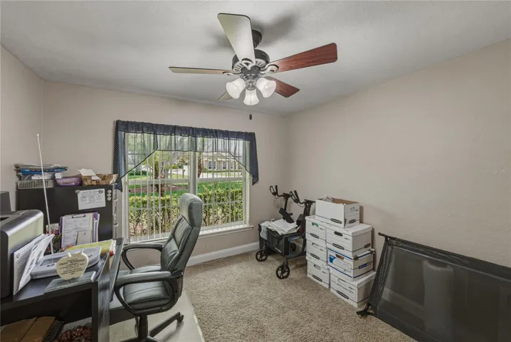 Bedroom 2 has a ceiling fan and quality carpeting.