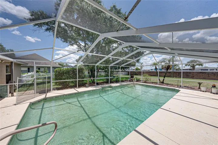 The pool has steps with railings at both ends of the pool.