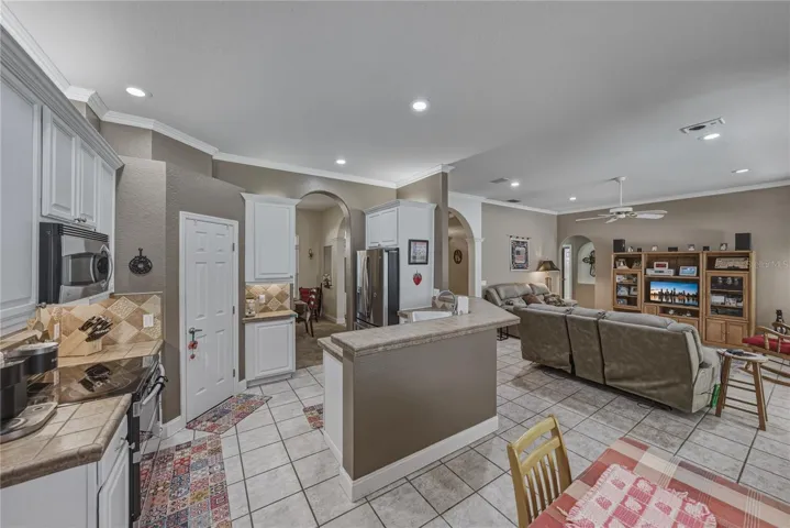 The kitchen has stainless steel appliances and a walk-in pantry.