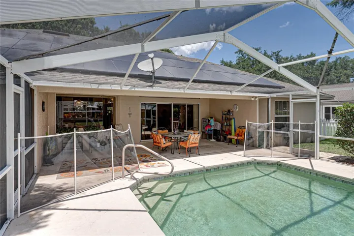The pool has steps and a railing for easy access.