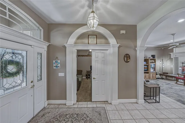 The den is at the front of the home accessed from the foyer. Architectural touches add to the beauty of the home.
