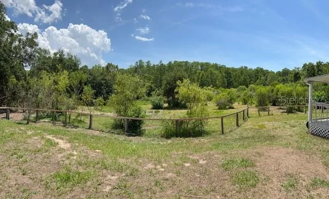 BEAUTIFUL PIECE OF PROPERTY WITH A DOUBLE WIDE REFRESHED MANUFACTURED HOME.  NEW ROOF + HVAC.