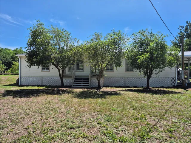 DOUBLE WIDE - MOVE IN READY. NEW ROOF + HVAC.  FRONT PORCH AND EXTRA LARGE BACK PORCH