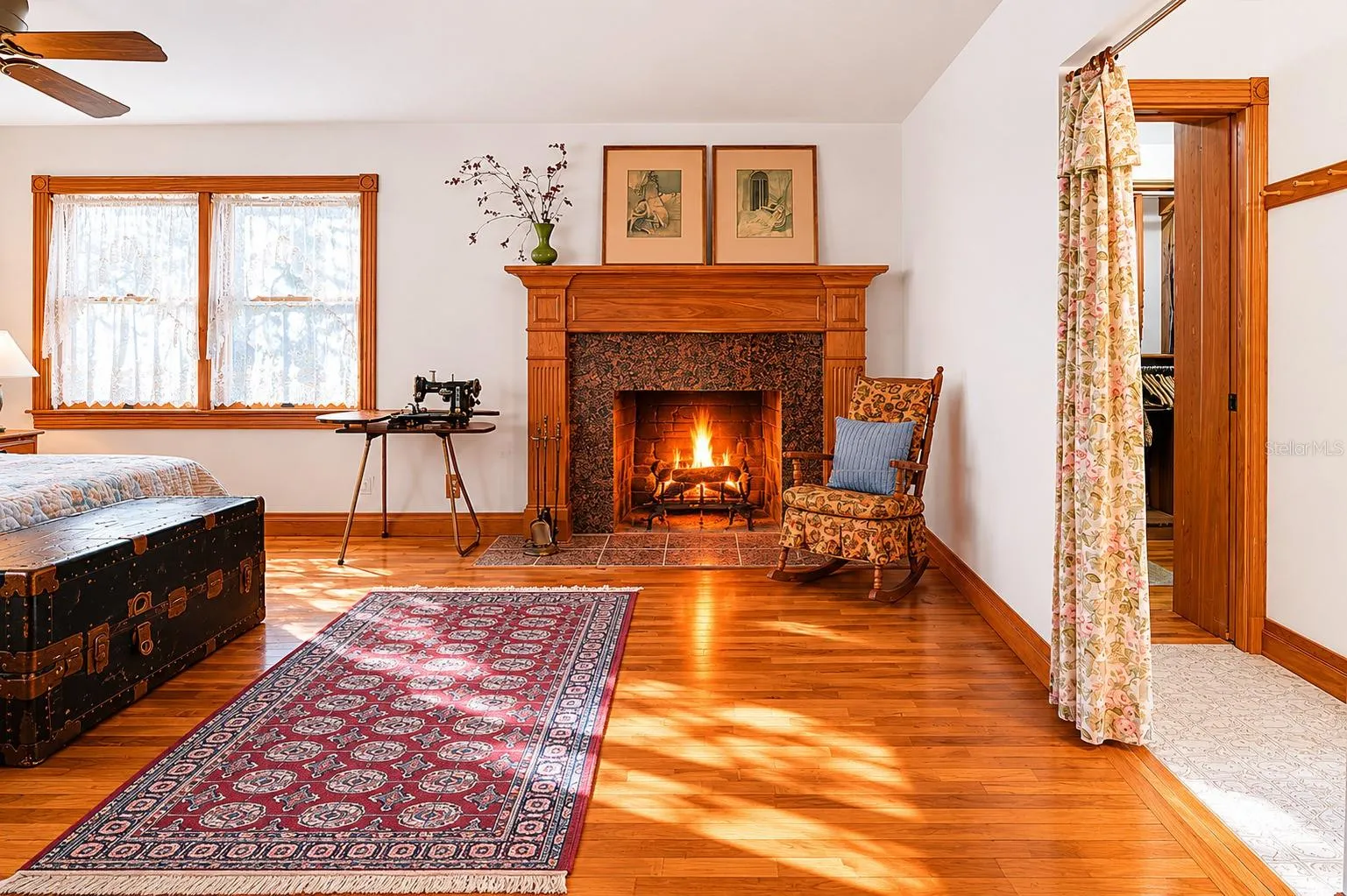The Primary features its own wood-burning fireplace with stone surround.